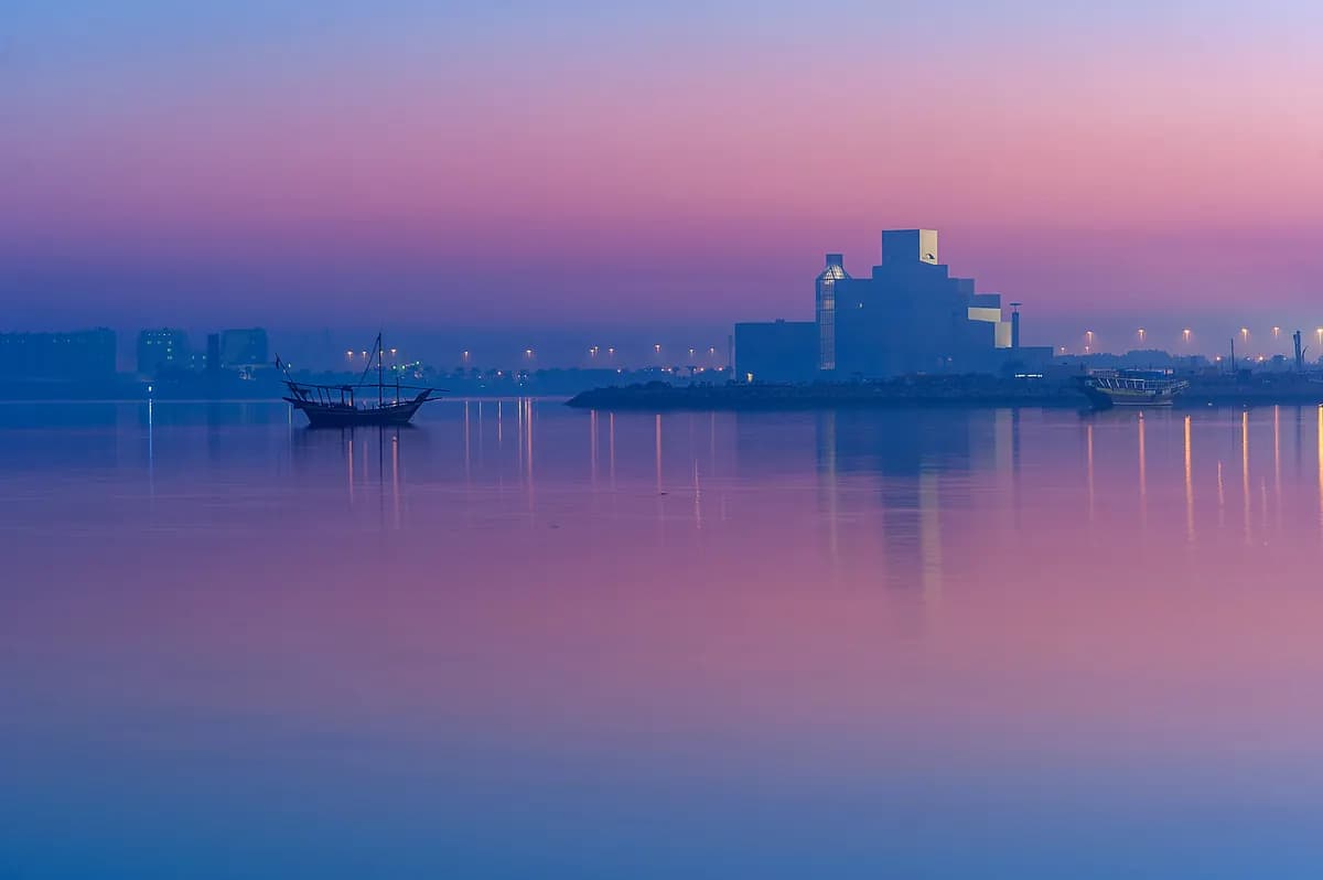 Museum of Islamic Art on the Doha waterfront at dusk